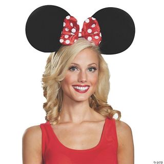 A woman wearing Minnie Mouse ears.